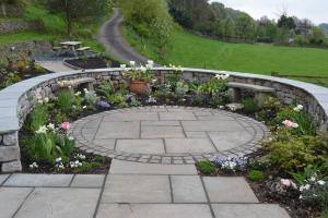 Sandstone Seating Area with Limestone Wall Sandstone Seating Area with Limestone Wall