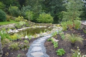 Lined pond 'damming and existing stream' Lined pond 'damming and existing stream'