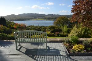 Garden patio with local slate paving overlooking Windermere Garden patio with local slate paving overlooking Windermere