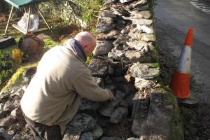 The drystone wall being built in Langdale Traditionally built drystone wall in Langdale