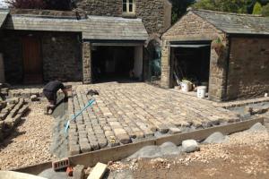 The driveway is starting to take shape Landscaping work Kirkby Lonsdale driveway using reclaimed sets