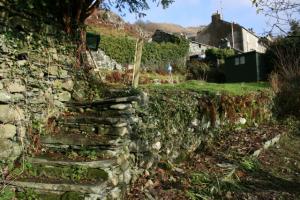 Steps leading way through garden part way through the landscaping works Chapel Style, Langdale, Lake District; some stone steps mid way through the work