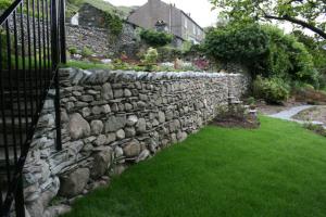 The stone steps and walling after landscaping works aiding the flow of the garden Chapel Style, Langdale, Lake District; our stone steps and walling after works