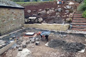 Stone walling progress using sandstone to surround the drive Stone walling to surround the drive in High Casterton